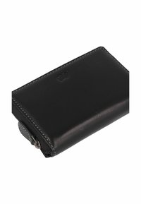 Black leather wallet with a smooth finish, featuring white stitching and a zipper closure. Compact rectangular shape, subtle logo detail.