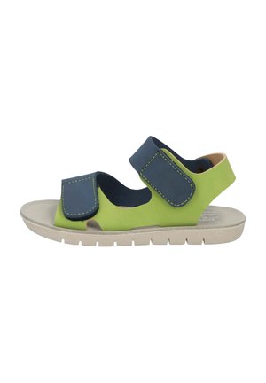Children's sandal with lime green and navy straps, two adjustable Velcro closures, and a light beige flexible sole.