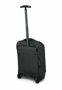 Valigia a rotelle in tessuto nero con manico verde retrattile, dotata di due ruote e una tasca posteriore con zip.