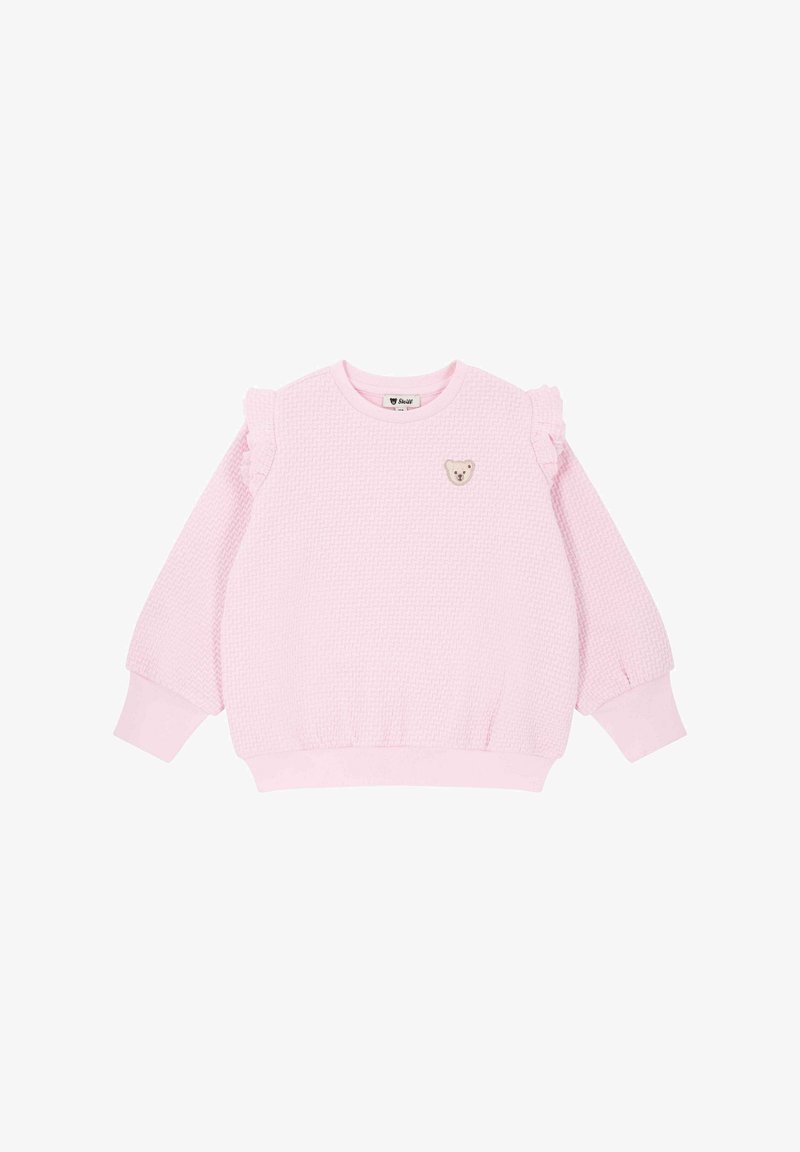 Sweat-shirt rose texturé avec des accents de manches froncées, un col rond et un petit patch d'ours sur le devant, avec des poignets et un ourlet côtelés.