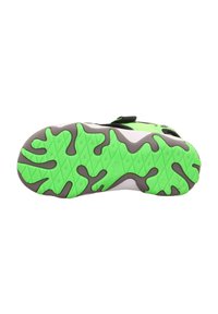Schuhsohle mit einem grün-grauen Camouflage-Muster; strukturierte Griffigkeit mit Rillen; leuchtend limegrüne Akzente; insgesamt flexibles Design.