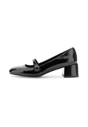 Escarpin Mary Jane en cuir verni noir avec un bout rond, une sangle ajustable et un talon large. Texture lisse et finition brillante.