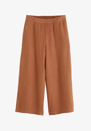 Bredde bukser lavet af letvægtsstof i en varm terrakottafarve, med elastisk talje og to sidelommer.
