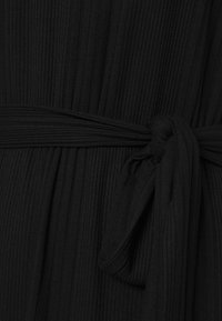 Object Trikoomekko - black