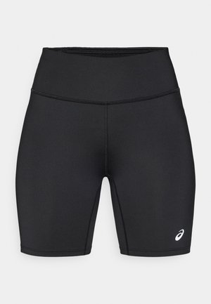Shorts de sport noirs en tissu lisse et extensible, avec une taille haute, une coupe ajustée et un logo blanc distinctif sur le côté.