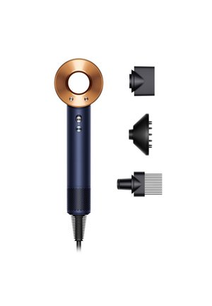 Asciugacapelli Dyson blu navy con accenti color rame. Presenta un design circolare, finitura metallica e tre accessori a beccuccio staccabili.