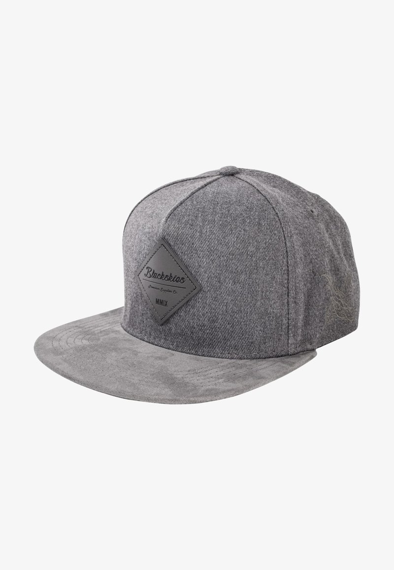 Gray snapback cap with a textured wool upper, flat brim, and a rubber patch featuring brand name and year on the front.