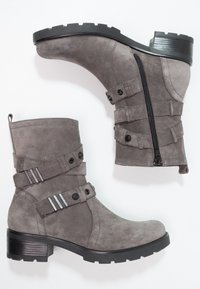 Gray suede ankle boots with a textured finish, featuring a side zipper, double strap accents, and a chunky black heel.