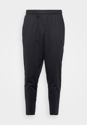 Pantaloni sportivi neri con un fit slim, vita elastica e tasche laterali. Realizzati in tessuto leggero e liscio. Caratterizzati da logo.