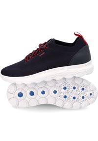 Black knit athletic shoe with red accents, pod-like white sole featuring blue circles, and a smooth black heel support. Geox branding visible.