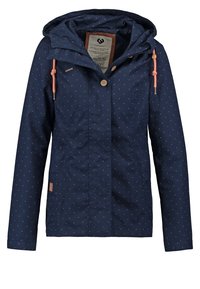 Marinblå regnjacka med huva, som har knappstängning, prickigt mönster, två sidofickor och dragsnoddar.