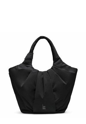 Sac cabas en tissu noir doux avec larges plis et poignées rembourrées, logo "Got Bag" au centre devant.