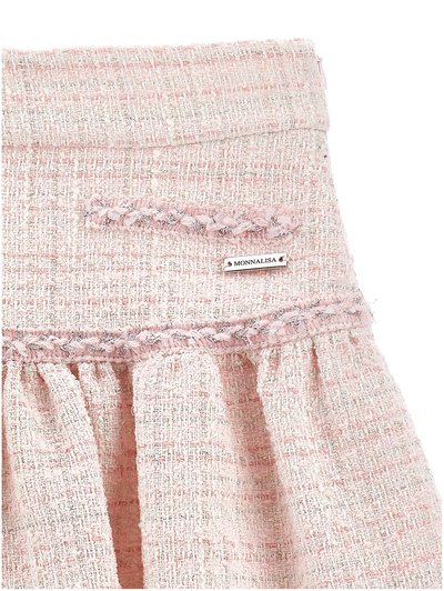 Roza teksturirana krilo iz tvida z vpletenim trakom, nabranim pasom in majhno kovinsko znamko z napisom "Monnalisa".