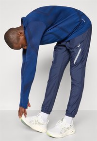 ASICS LITE-SHOW PANT - Outdoor trousers - midnight