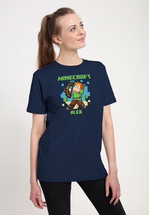 Navy blue T-shirt featuring a pixelated Minecraft character named Alex, holding a bow. The graphic displays vibrant colors and bold text.