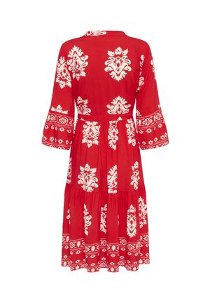 Rood patroon jurk met witte bloemmotieven, uitlopende mouwen en gelaagde rok. Gemaakt van lichtgewicht stof met een ontspannen pasvorm.