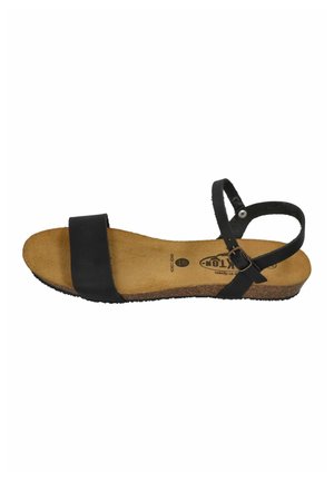 Open-toe flat sandal with wide black front strap, cork footbed, and adjustable black ankle strap with metal buckle.