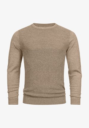 Beige gebreide trui met een textuur ribbelontwerp over de borst en een gladde lichaamsstructuur. Beschikt over een ronde halslijn en aangesloten manchetten.