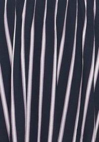 Navy fabric with vertical stripes in pale pink and white. Smooth texture with consistent pattern and flowing design elements.