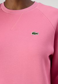 Lacoste Sportska majica - reseda pink