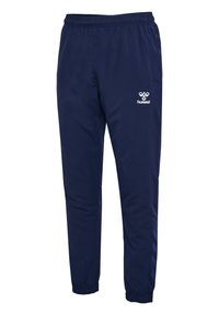 Marineblaue Sporthose mit elastischem Bund und Bündchen, mit weißem hummel-Logo am rechten Oberschenkel und dezenten Chevron-Streifen an den Unterschenkeln.