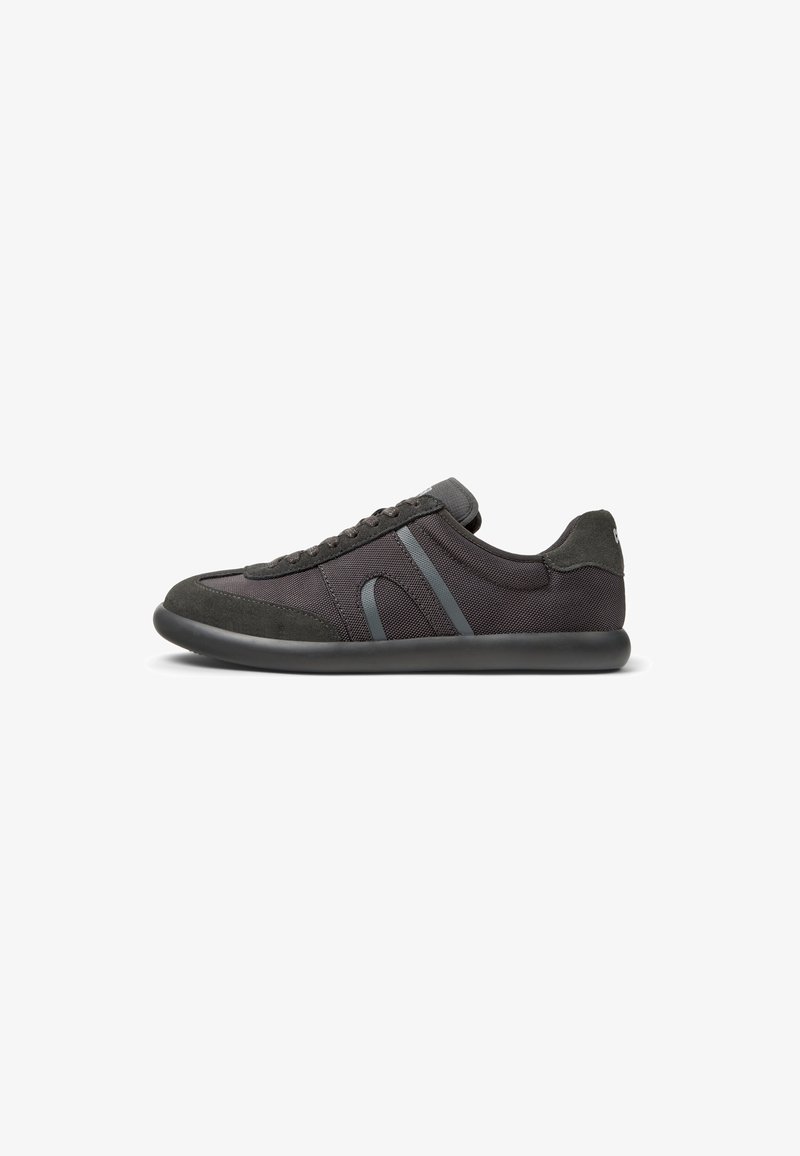 Black sneaker made of mesh and suede, featuring a rounded toe, gray accents, lace-up design, and a flexible rubber sole.