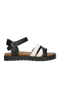 Černobílé dámské sandály s koženými pásky, texturovaným bílým svrškem, nastavitelným páskem kolem kotníku a odolnou platformou.