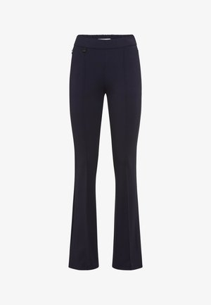 Navy flared pants made from stretchy fabric, featuring a smooth waistband, side pockets, and subtle stitch detailing.