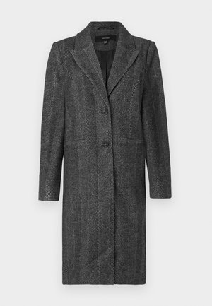 Grijze visgraatjas van een gestructureerde stof. Kenmerken zijn een opstaande kraag, een enkele knoopsluiting en zijzakken. Lange mouwen en knielang.