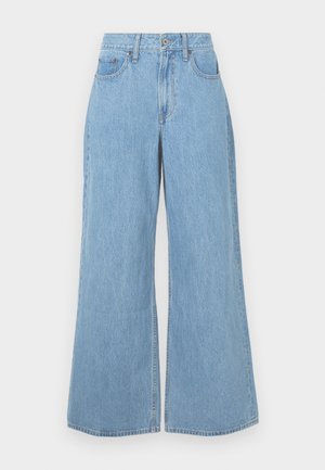 Light blue wide-leg jeans made of denim, featuring a high waist, front pockets, and a raw hem with subtle fading and textured finish.