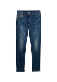 Jeans de mezclilla azul oscuro con un diseño de pierna recta, parches deslavados y herrajes de cobre, incluyendo un botón y remaches. Estilo clásico de cinco bolsillos.