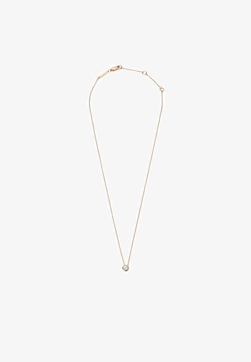 Collana in tonalità oro con una catena sottile, caratterizzata da un piccolo pendente rotondo in cristallo trasparente al centro. Design semplice e consistenza delicata.
