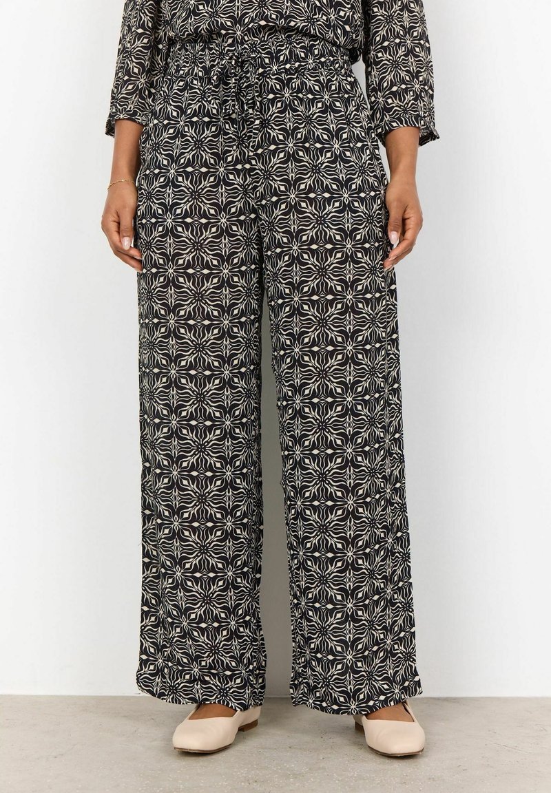 Svarta vida byxor med ett neutralt blommigt geometriskt mönster, elastisk midja och lätt, texturerad tyg.