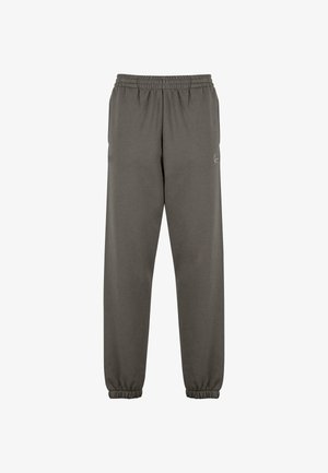 Pantalons de sport gris en tissu doux, avec une taille élastique, des ourlets côtelés et un petit logo sur la cuisse gauche.