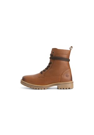 Bottine en cuir marron à lacets, avec un col rembourré, une languette de tirage et une semelle en caoutchouc crantée, présentée en profil latéral sur un fond blanc.