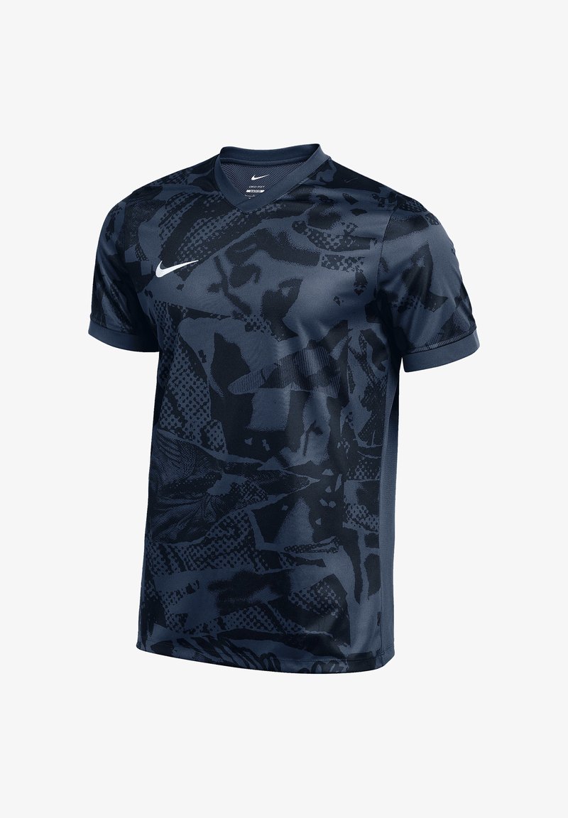 Ciemnoniebieska sportowa koszulka Nike z czarnymi abstrakcyjnymi wzorami i białym logo Nike w kształcie łyżwy na piersi, z krótkimi rękawami i dekoltem w serek.