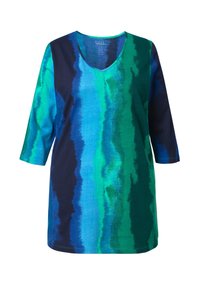 V-hals tunika med trekvartærmer, der har lodrette gradientstriber i blå, teal og marineblå farver på bomuldsstof.