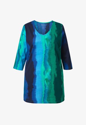 Tunika con scollo a V e maniche a tre quarti, caratterizzata da strisce verticali a gradiente nei colori blu, verde petrolio e blu scuro su tessuto di cotone.