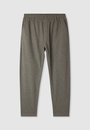 Jogger grigi in tessuto testurizzato con vita elasticizzata, tasche laterali e gambe affusolate. Tessuto morbido con un motivo sottile.