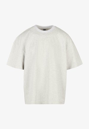 Lys grå bomulds t-shirt med korte ærmer, rund hals og en afslappet pasform. Stof overfladen er blød og let struktureret.