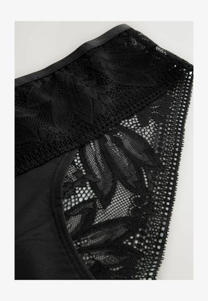 Chiloți din dantelă neagră cu un model floral, spate opac și finisaje detaliate din plasă pe talie și părțile laterale.