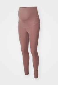 Leggings za trudnice, mekani rastezljivi materijal, visok struk, boja mauve, pripijeni kroj, uparen s bijelim Nike logom blizu gležnja.