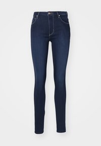 Úzke džíny z tmavého denim, s vysokým pásom, piatimi vreckami, zapínaním na zips a gombík, kontrastným prešívaním a minimálnym brandingom.