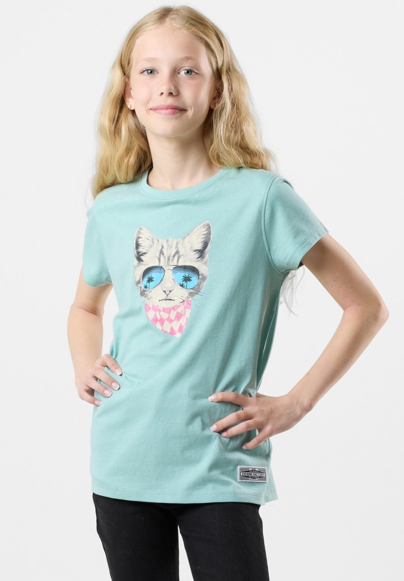 Light blue cotton T-shirt featuring a graphic of a cat in sunglasses with a pink scarf. Short sleeves, round neckline, and relaxed fit.