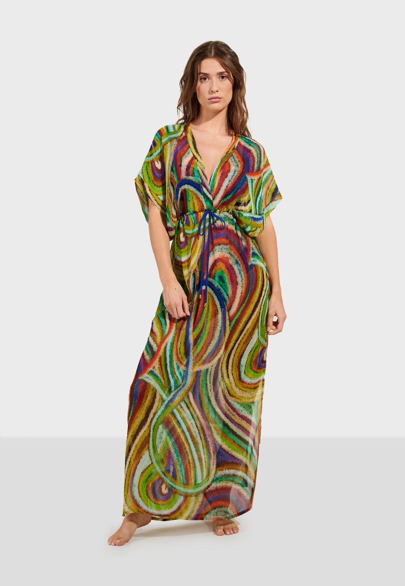 Robe maxi en tissu transparent avec un motif de tourbillon multicolore. Décolleté en V avec une taille à cordon et des manches larges.