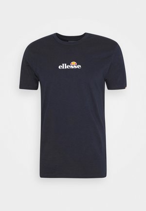 Navy blue cotton t-shirt with short sleeves, featuring a white "ellesse" logo and a multicolored round accent above the text. Smooth texture.