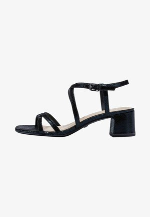 Black heeled sandals with three wide straps, textured material, adjustable buckle, and a square block heel. Smooth insole.