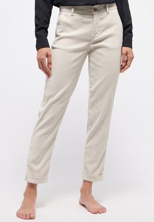 Beige Cordhosen mit geradem Schnitt, Knopfverschluss und umgeschlagenen Säumen. Strukturierter Stoff mit feinen Streifen und seitlichen Taschen.