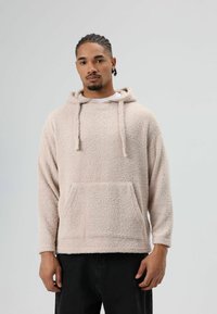 Lichtbeige hoodie van gestructureerd fleece, met een voorzak, capuchon met trekkoord en lange mouwen.