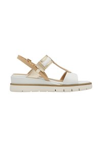 Sandalo con una combinazione di colori bianco e beige, tomaia in pelle, punta aperta, cinturino regolabile con hardware e una suola spessa bianca con accenti testurizzati.